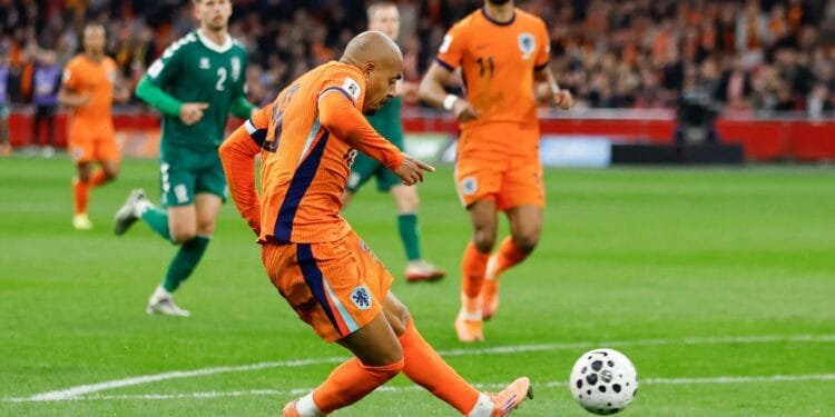 Rapid-fire Oranje reach World Cup with 4-0 win over Lithuania