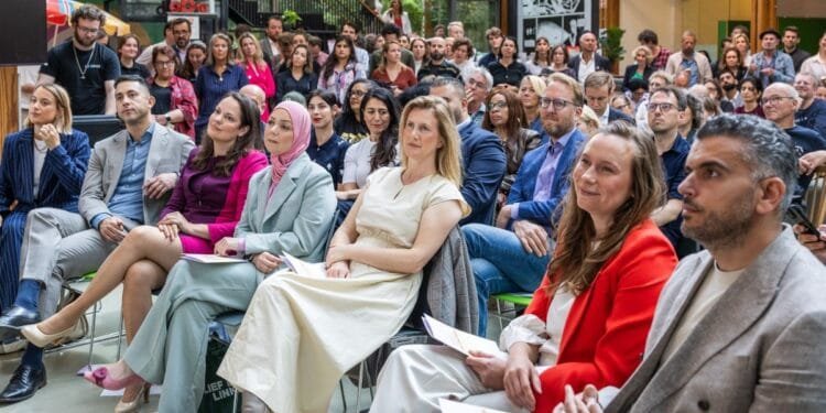 Does “Our Amsterdam” policy include internationals and startups?