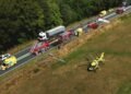 One person dies, six injured in crash between lorry and minibus